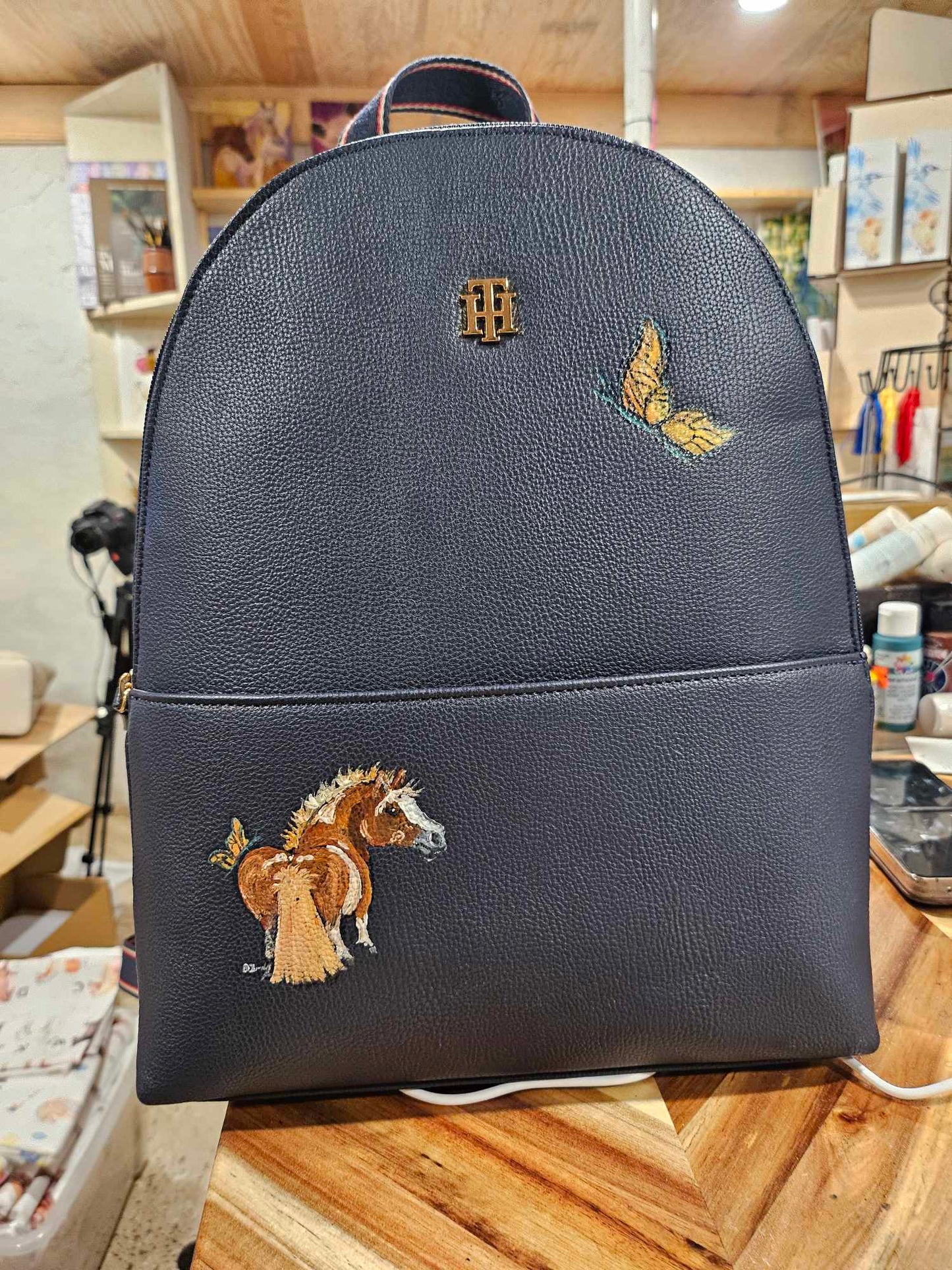 Adorable Chestnut Pony with Butterfly on Navy Backpack