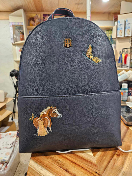 Adorable Chestnut Pony with Butterfly on Navy Backpack