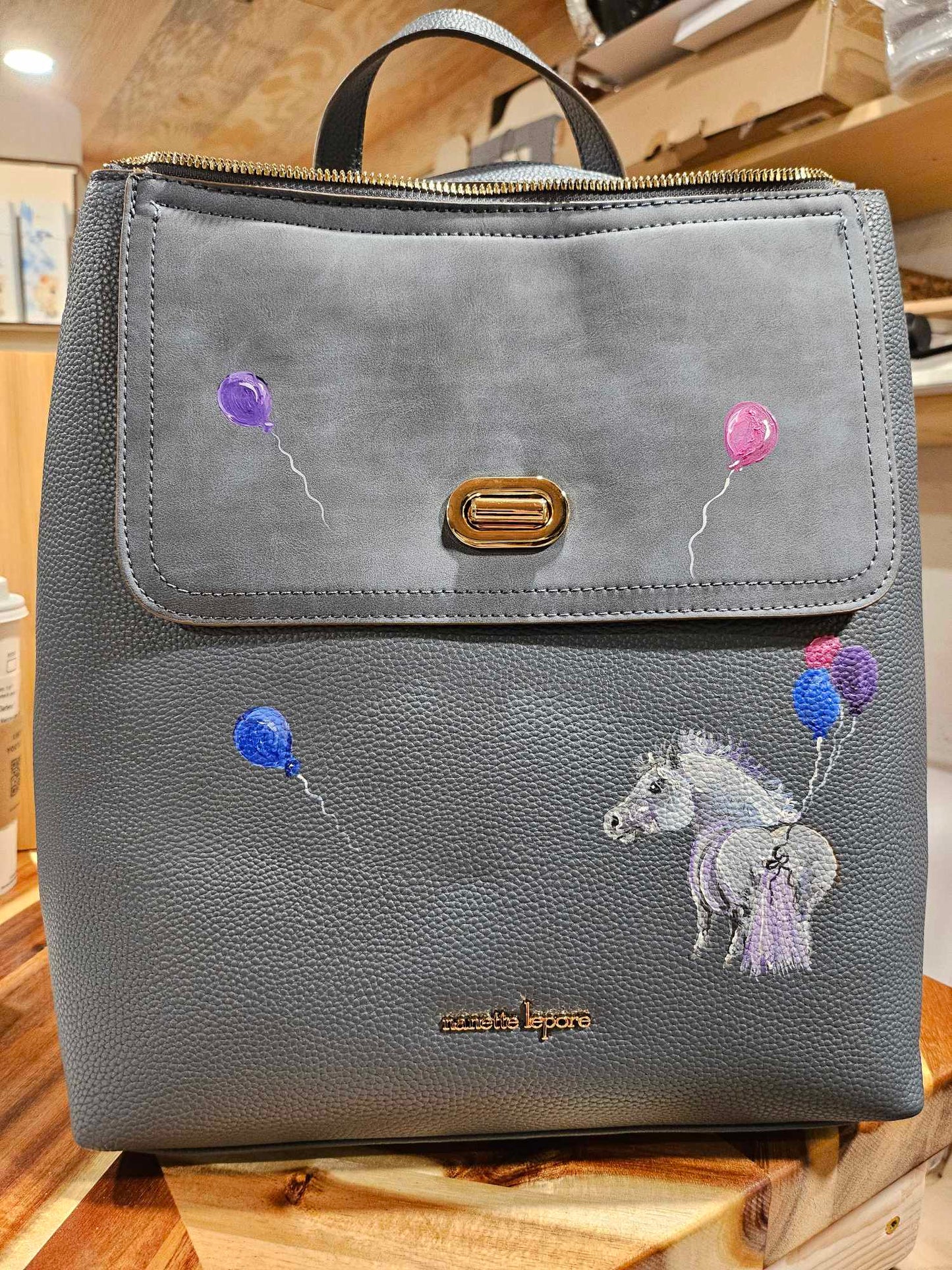 Adorable Grey Pony with Balloons on Grey Backpack